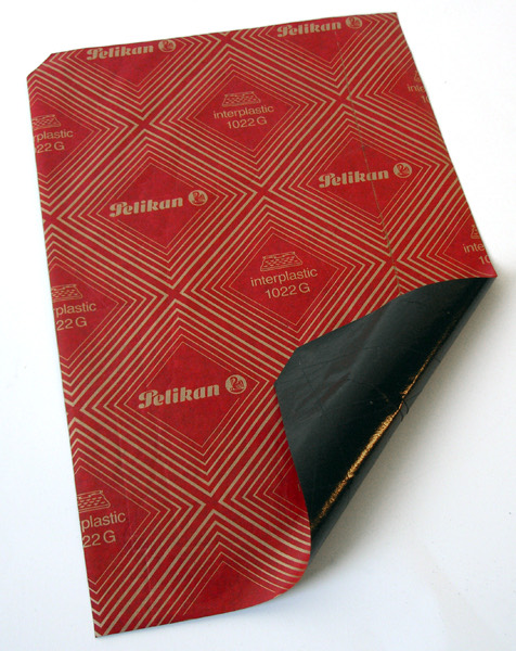 Carbon paper: every keystroke printed on the copies underneath, mistakes included.